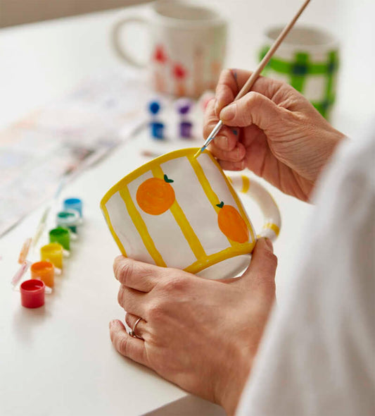 Pott'd Paintables cups for adults, ceramic painting set with cups, paints, brushes, and painting inspirations for painting the cups yourself.