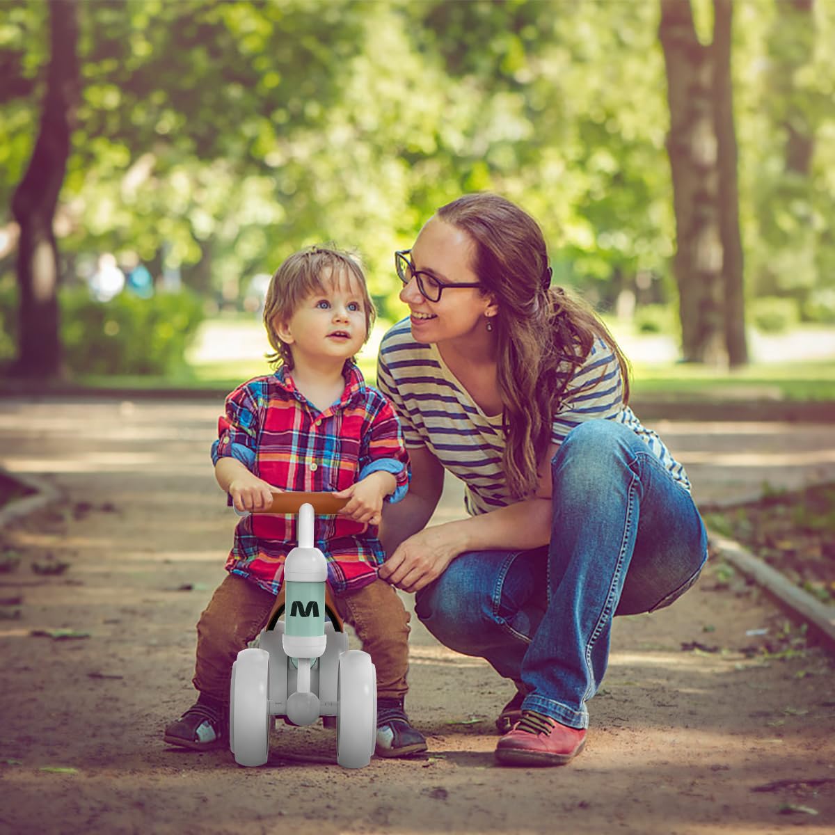 Toddler balance bike for 1 year and up, with 4 wheels for 10-24 month old babies. First ride-on bike for boys and girls as a gift - light green.