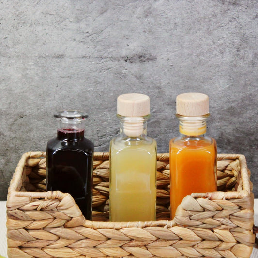 gouveo 24-pack glass bottles 100 ml apothecary design square with cork (HGK) - small 0.1 l glass bottle for liqueur, oil, vinegar, decoration (AFET100HGK)