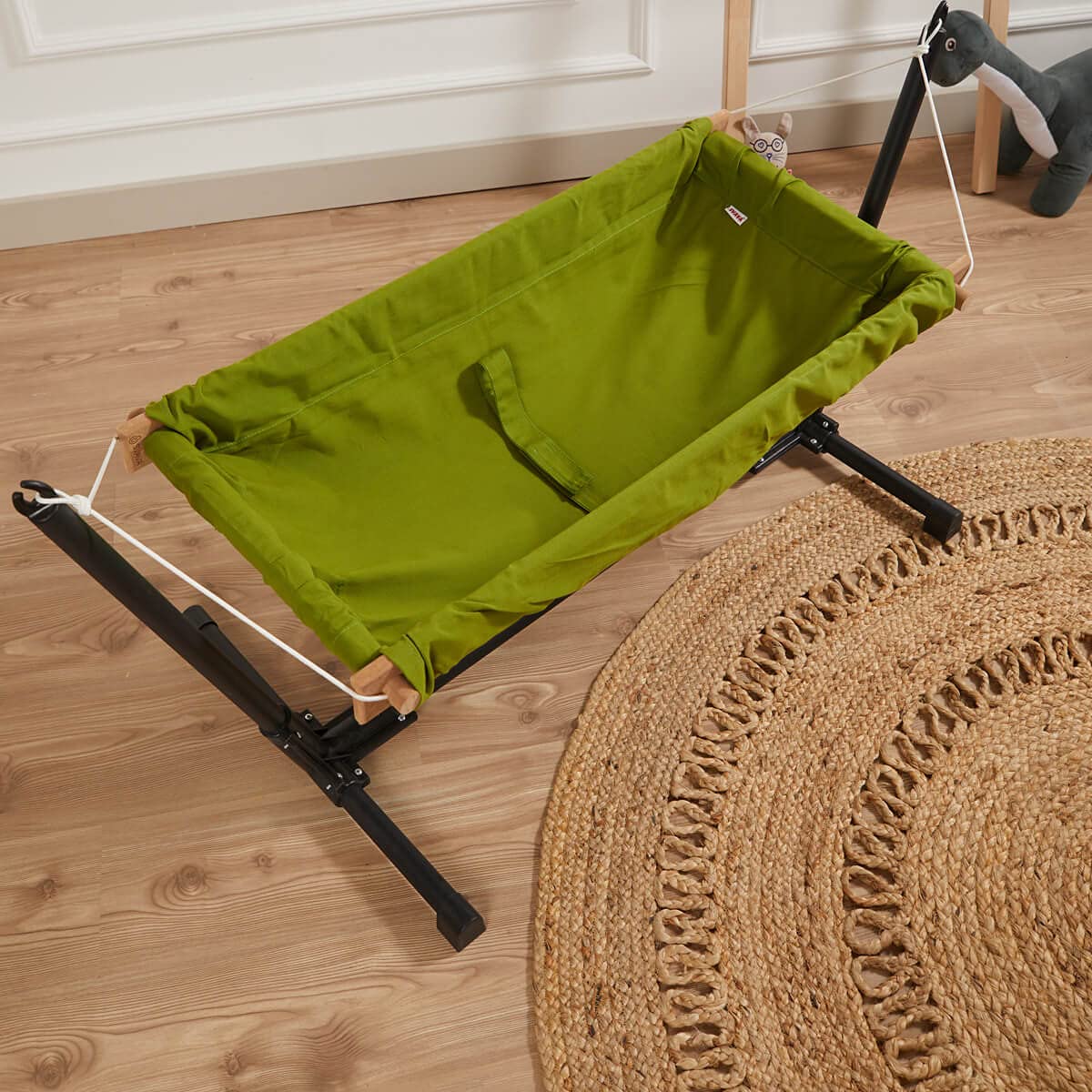 Baby Hammock with Stand. Made from 100% cotton, this travel-friendly baby hammock comes with a wooden swing stand for your little one to rest and play comfortably.