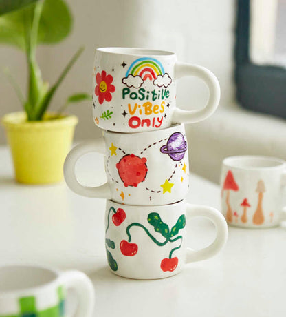Pott'd Paintables cups for adults, ceramic painting set with cups, paints, brushes, and painting inspirations for painting the cups yourself.