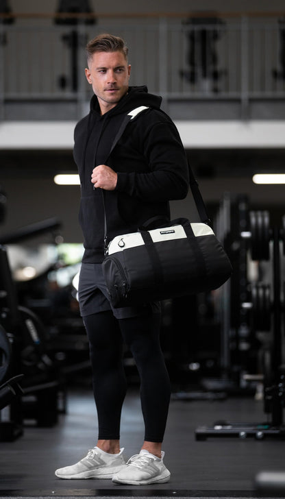 Fitgriff® sports bag & travel bag V2 for women and men - with shoe compartment & wet compartment - bag for sports, fitness, travel - training bag, gym bag, (Black/Cream White, Small)