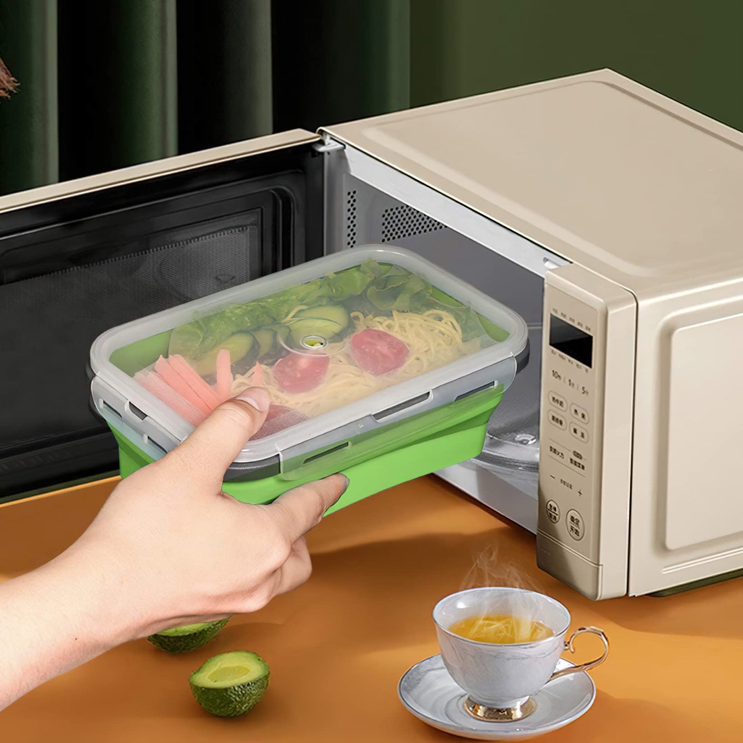 Collapsible silicone storage container with lid, portable bento box for space-saving, microwave-safe, 4-piece set, green.