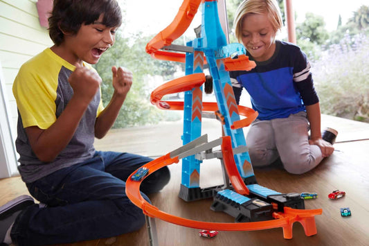 Hot Wheels Sky Crash Tower, 60cm tall with battery-powered booster and orange track with loop, gift for kids ages 5-10, variations in packaging may occur, GWT39.