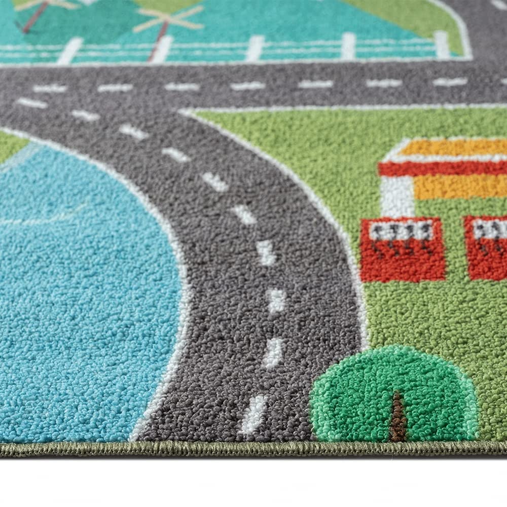 Children's play rug with cityscape on grass in green size 80x150 cm.