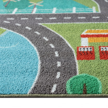 Children's play rug with cityscape on grass in green size 80x150 cm.