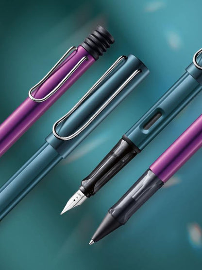 Lamy AL-star lilac Rollerball - light pen with transparent, ergonomic grip & medium nib - aluminum body - includes medium rollerball refill M 63 in black.