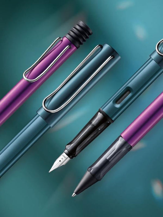 Lamy AL-star lilac Rollerball - light pen with transparent, ergonomic grip & medium nib - aluminum body - includes medium rollerball refill M 63 in black.