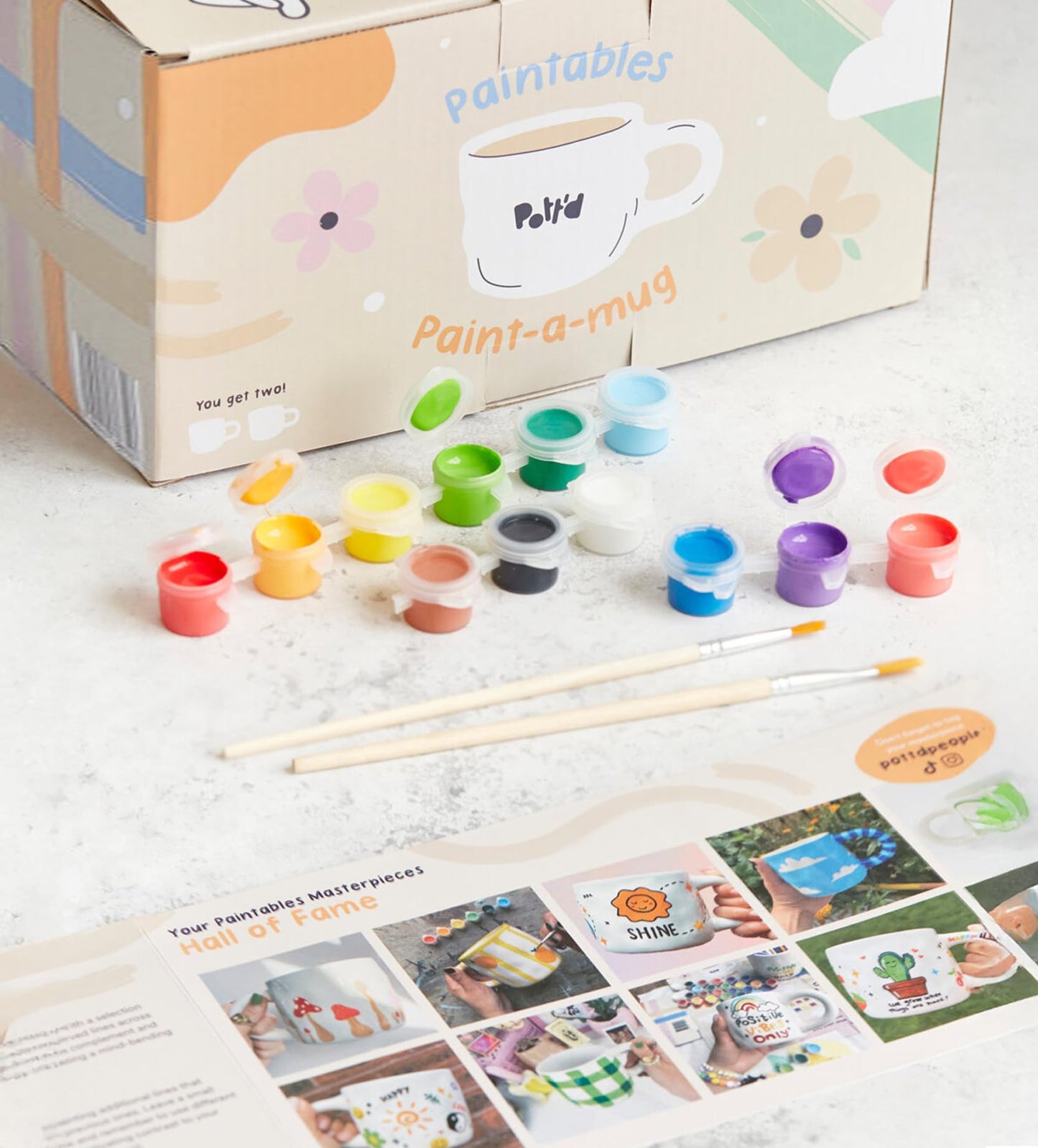 Pott'd Paintables cups for adults, ceramic painting set with cups, paints, brushes, and painting inspirations for painting the cups yourself.