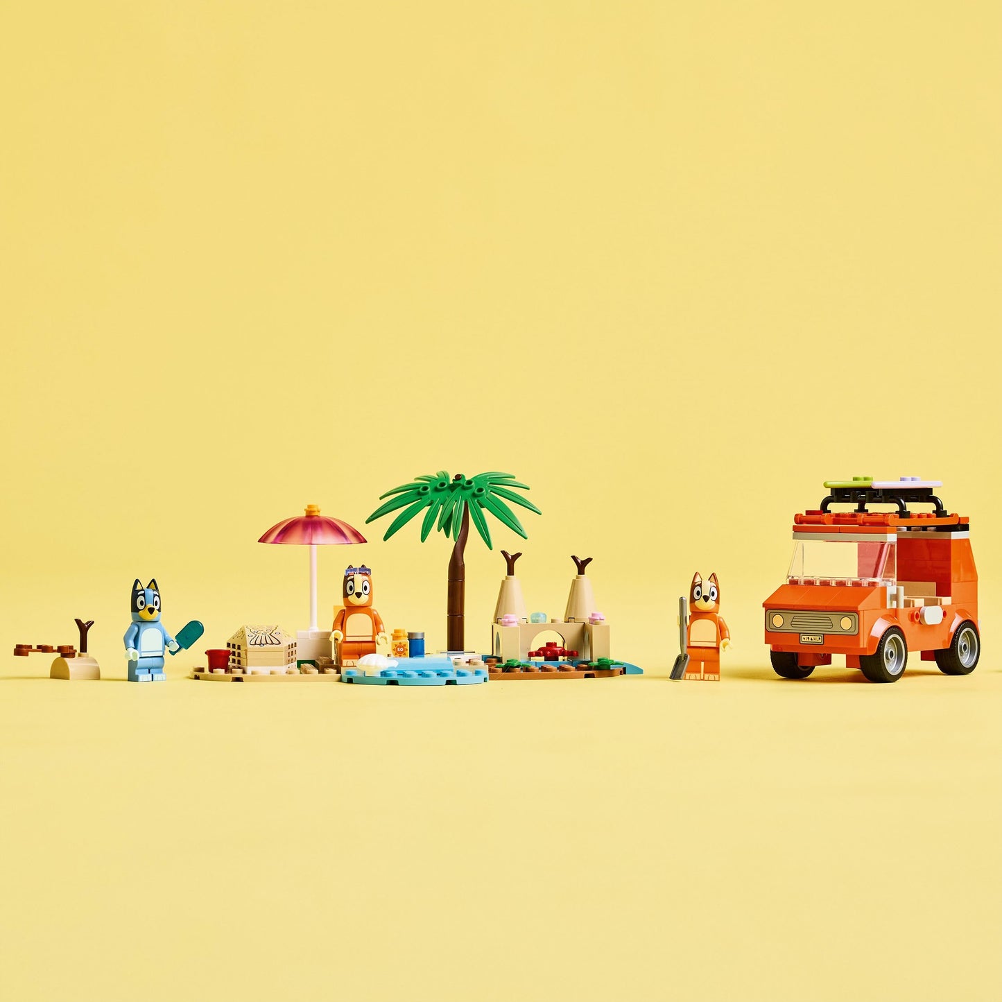 LEGO Bluey: Bluey's Beach & Family Car Trip Toy includes 3 minifigures (Bingo & Chilli), 2 surfboards, a sand castle, and fun accessories. Perfect birthday gift for 4+ year old girls & boys. - 11202