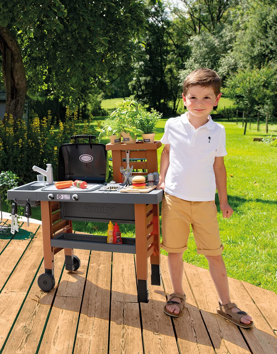 Smoby - Outdoor garden play kitchen - includes grill, sink with water pump function, and many accessories, for children ages 3 and up.