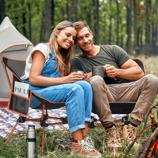 Sportneer folding camping chair is lightweight and portable, supporting up to 150kg. Compact and easy to carry with a carrying bag, perfect for picnics, outdoor activities, and hiking. Available in orange.