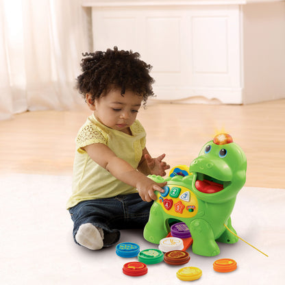 Vtech Baby Feed Me Dino - Talking dinosaur for feeding and learning, with songs, buttons, and quiz game - For children aged 12-36 months.