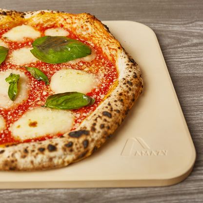 Amazy pizza stone including bamboo pizza peel, parchment paper, and insert - The ultra heat-resistant bread baking stone gives your pizza the original Italian flavor of crispy stone oven pizza.
