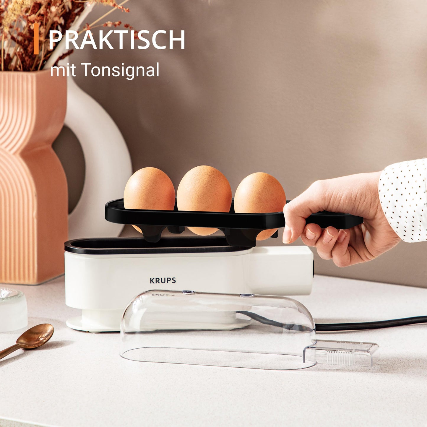 Krups Ovomat Trio egg cooker, For up to 3 eggs, Includes water measuring cup with egg piercer, egg holder, signal tone, EG234115, White/Black
