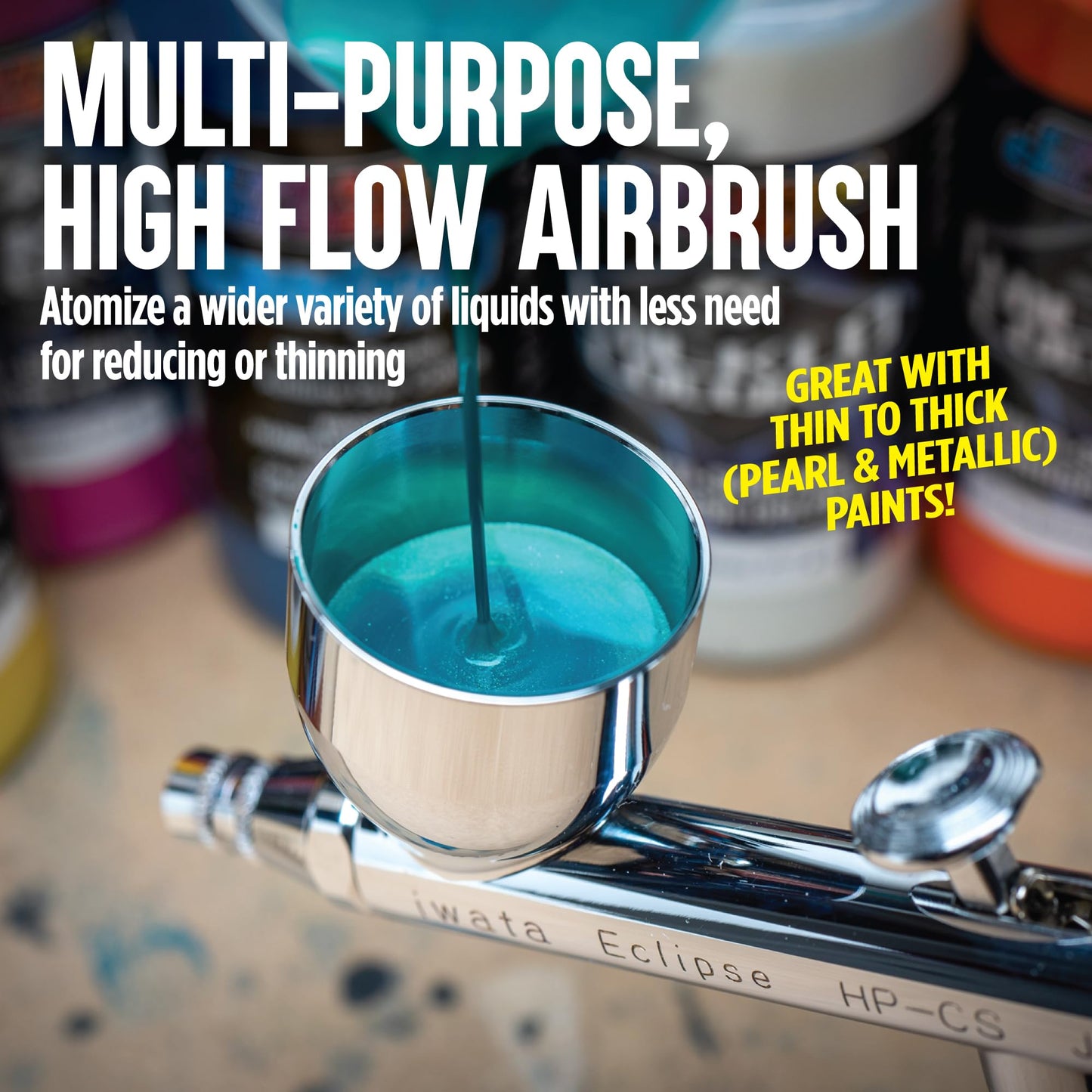 Iwata-Medea Eclipse HP CS Dual Action airbrush gun with gravity feed cup.