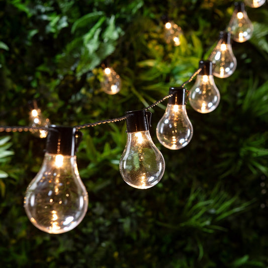 Lights4fun 20 LED Bulb Party String Lights in warm white for outdoor and indoor use. Battery-powered, perfect for decorating your garden, balcony, or tree. 7.75m long, ideal for summer and spring.
