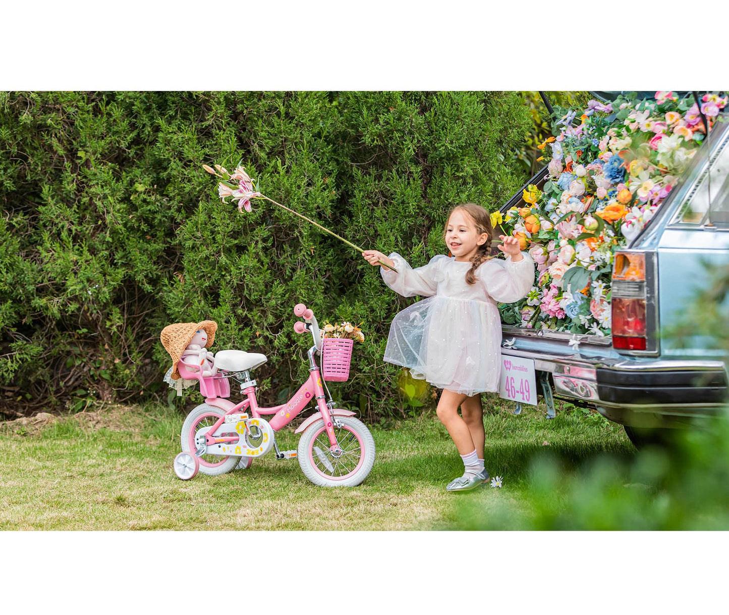 Glerc Maggie 12 inch kids bike for 1 2 3 4 year old girls. Princess style with doll seat, basket, training wheels & bell. Perfect birthday gift, pink to white.