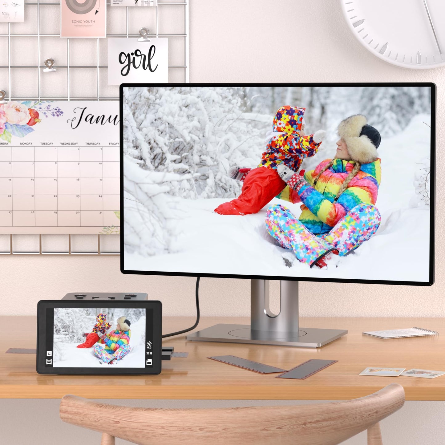 Digital film and slide scanner with large 5-inch LCD display, converts 135, 126 KPK, 110 negatives, color and black-and-white slides, and Super 8 film into 22 MP JPEG images.