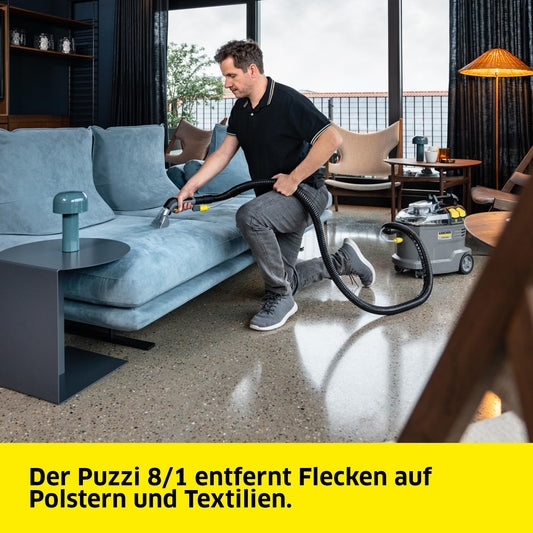 Kärcher carpet cleaner Puzzi 8/1, powerful for upholstery cleaning and spot removal on textiles, includes ergonomic short upholstery nozzle.