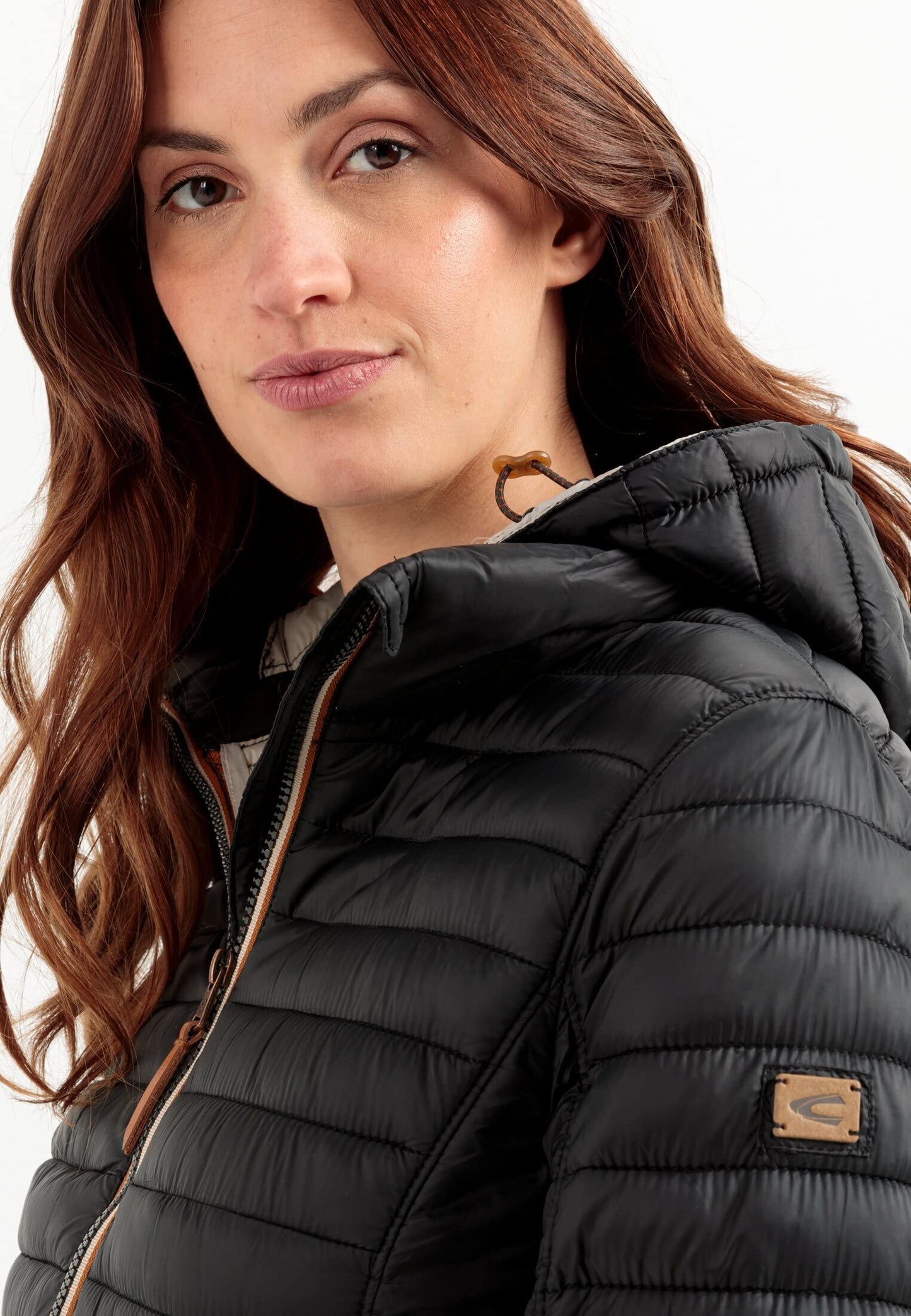 camel active women's lightweight quilted jacket with removable hood in black, size 44.