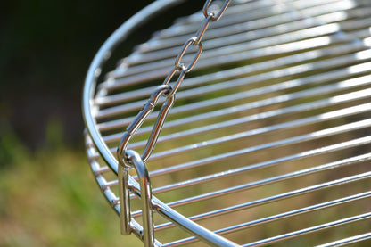 Three-legged swing grill including 60 cm stainless steel grate from German production.