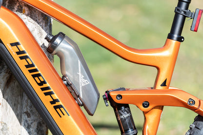 XLC Bicycle Water Bottle: The XLC MRS Set MR-S14 with adapter for existing MRS rail MY2021 on the bike, adapter for Fidlock, and water bottle, 650ml.