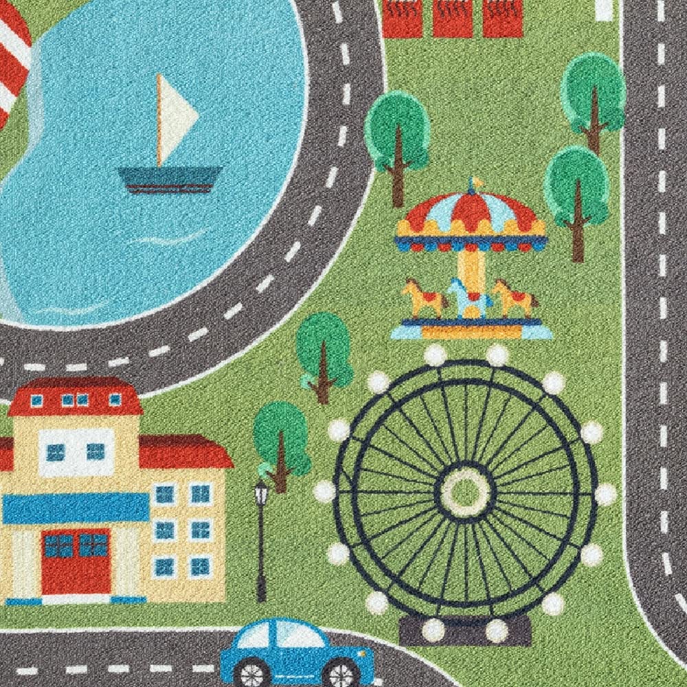 Children's play rug with cityscape on grass in green size 80x150 cm.