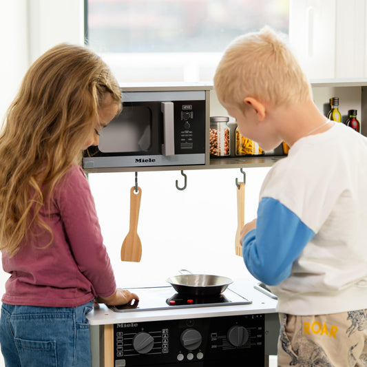 Theo Klein 7199 Miele Kitchen, White wooden kitchen including stove with sound and light, high-quality kitchen accessories made of stainless steel (not heatable) and wood, toy for children ages 3 and up.