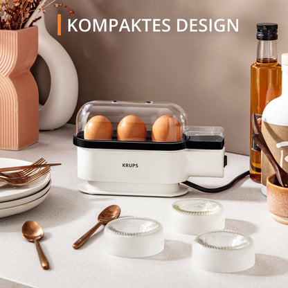 Krups Ovomat Trio egg cooker, For up to 3 eggs, Includes water measuring cup with egg piercer, egg holder, signal tone, EG234115, White/Black