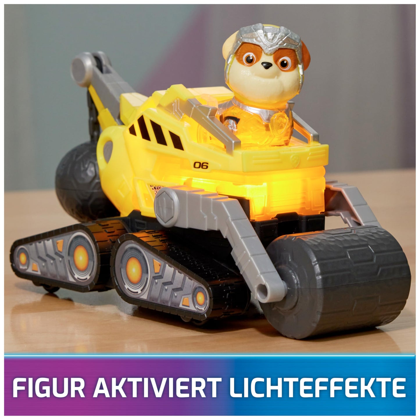 PAW Patrol: The Mighty Movie, superhero base vehicle by Rubble with puppy figure, construction vehicle with light and sound effects, toy suitable for children ages 3 and up.