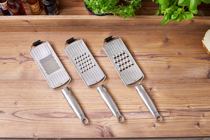 RÖSLE coarse grater, high-quality grater for raw vegetables, potatoes, vegetables or cheese, with silicone base, stainless steel 18/10, including protective cover, 36 x 7.7 x 2 cm, silver-colored