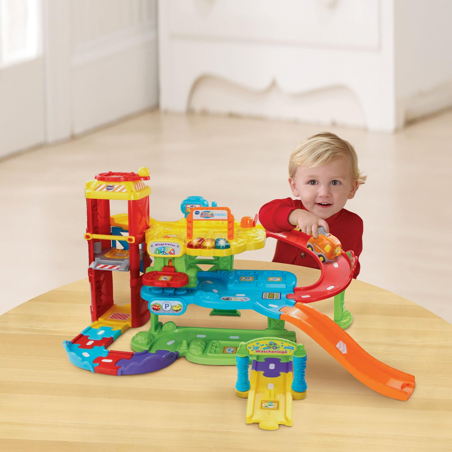 VTech Baby Go! Go! Smart Wheels - Park and Learn Deluxe Garage - Interactive toy with tow truck, elevator, ramp, gas station and more - For children aged 1-5 years.