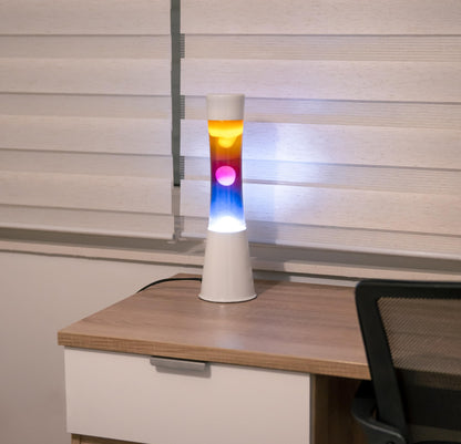 FISURA - Multicolored lava lamp. White base and glass with multicolored gradient effect. Lamp for relaxation. Comes with spare bulb. 11 cm x 11 cm x 39.5 cm.