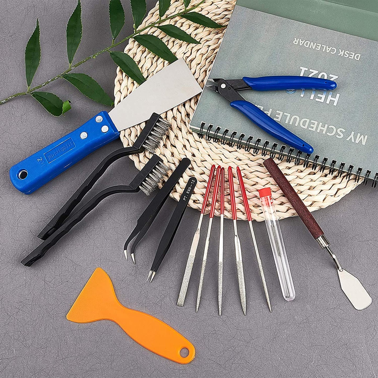 OLYCRAFT 23-piece 3D printer nozzle cleaning and removal tool set includes spatula knives, wire brush, scraper knives, diamond files, and tweezers for 3D printer cleaning.