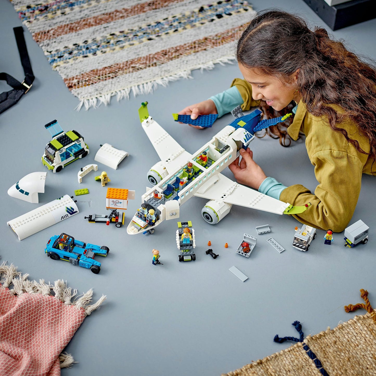 LEGO 60367 City Passenger Airplane Toy Set, large airplane model with airport ground vehicles: apron bus, pushback tug, catering loader, baggage cart, and 9 minifigures