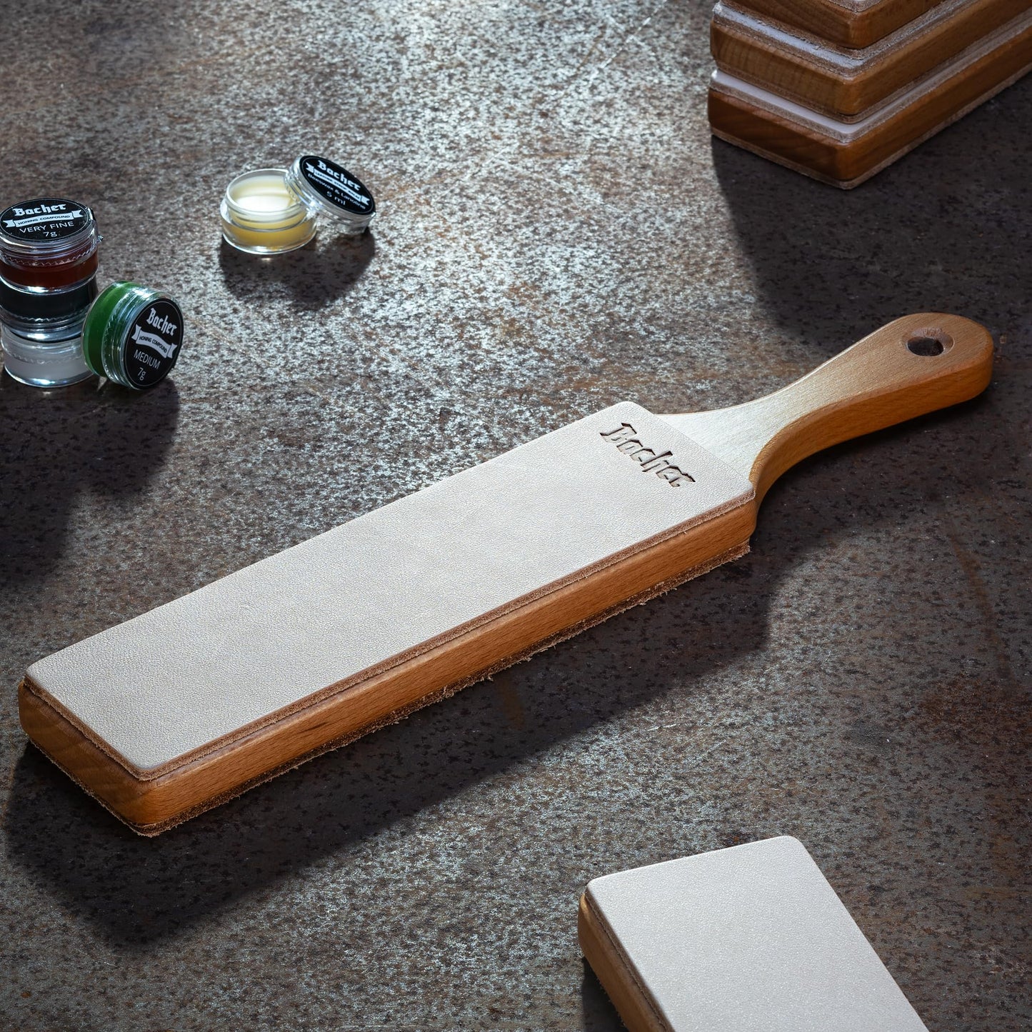 Bacher Premium Leather Strop Sharpening Tool for knives set with 4 x 7g polishing paste. Hardwood paddle handle, covered with 1/8" thick, bark-tanned cowhide.