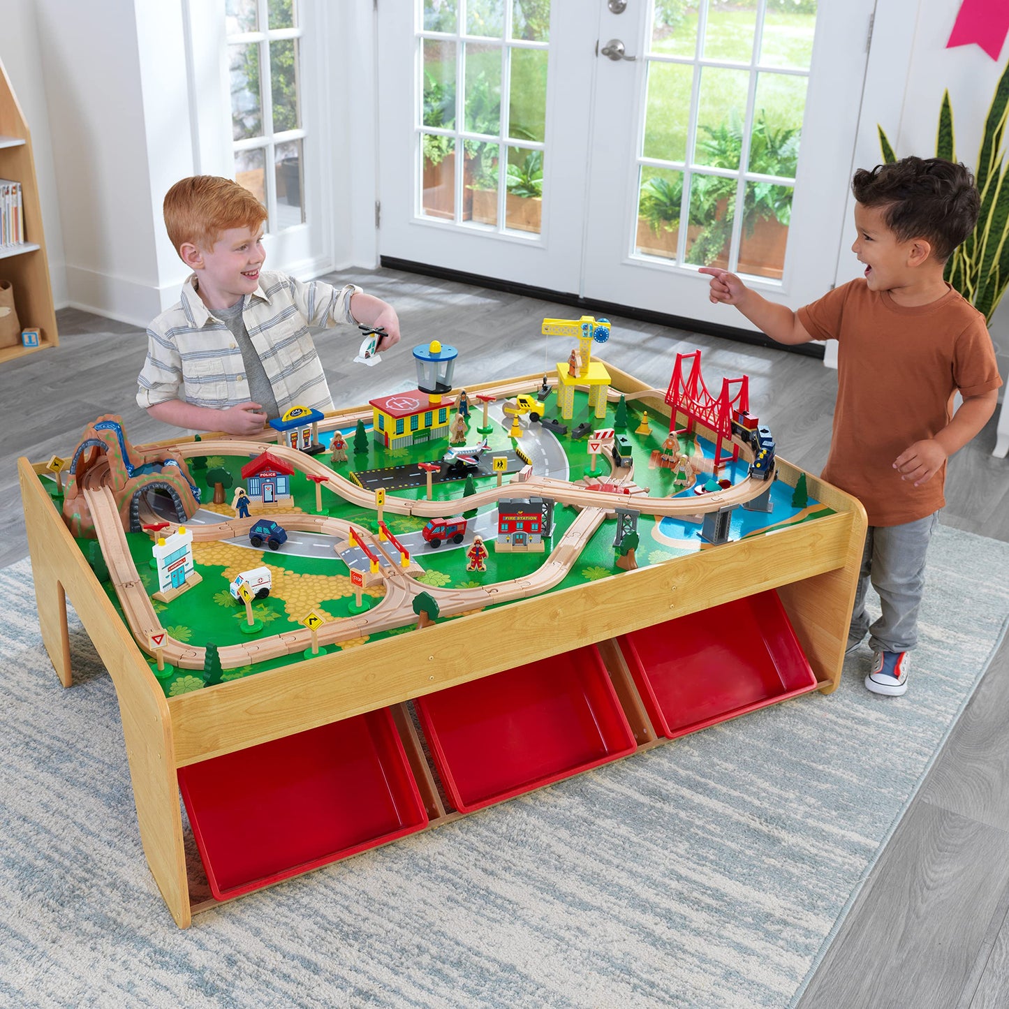 KidKraft Wood Train and Play Table Waterfall Mountain with storage box, train set with accessories and construction vehicles, airplane and train toys for children 3+ years old, 17850