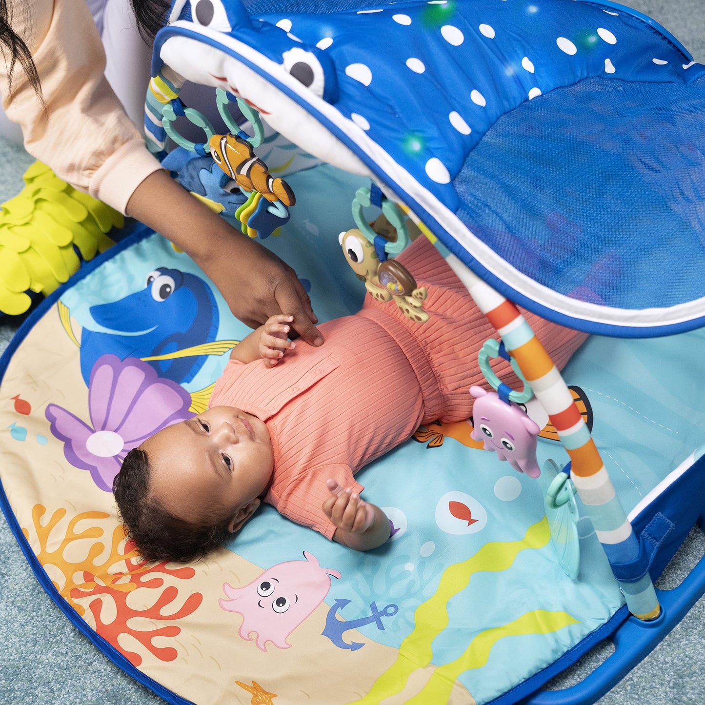 Bright Starts, Disney Baby, Finding Nemo playmat with play gym, lights, over 20 minutes of melodies, a Dory finger puppet, and more.
