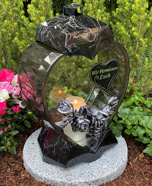 Grave lantern in heart shape with inscription "We miss you". Grave candle in black, 33 cm high. New model including candle, for grave decoration.