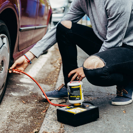 AirMan Resq tire repair kit for cars, featuring Valve-Through technology, repairs all tire types, including the powerful 12V air compressor tire sealant.